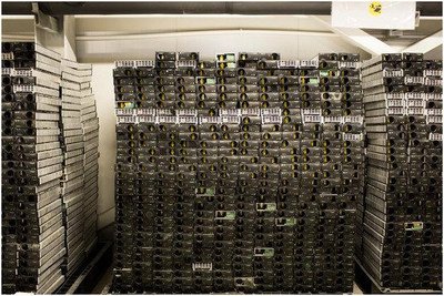 Miners working in a cryptocurrency mining farm